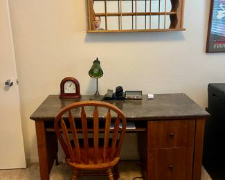 Desk, mirrored shelving, clock