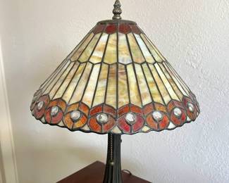 Tiffany-style table lamp with a stained glass shade