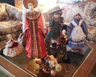 Dolls and other collectibles, some from international travel.