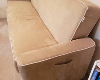 Adjustable back, and folds out to a futon bed.