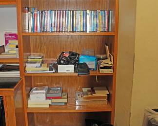 Bookcase with Books Dvds  Garmin  More
