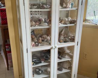 White cabinet with glass doors.    