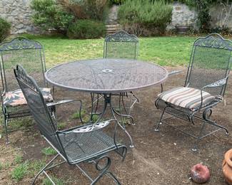 Wrought iron table-48x28 & 4  chairs-20x41