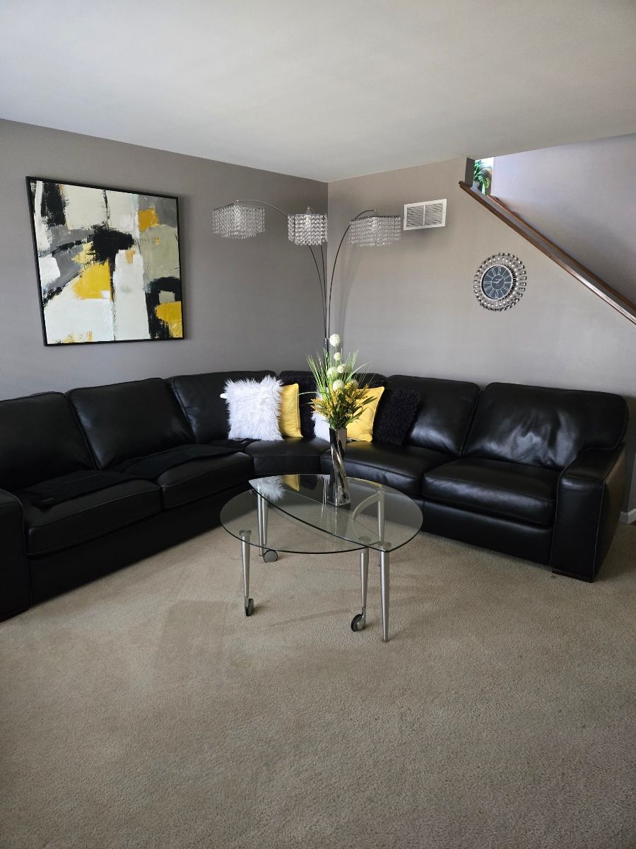 Black leather curved sectional  $2,500