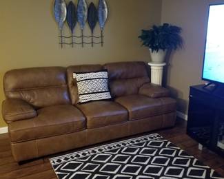Brown leather sofa with matching chair $1,250
