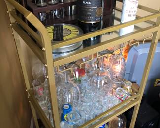 Glass bar cart on wheels with 3 shelves