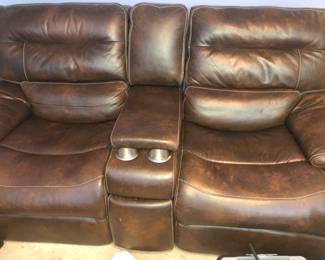 Brown leather recliner with cup holders 