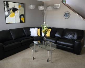 Black leather curved sectional $2,500