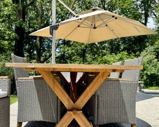 $600; outdoor wood table with 8 resin wicker and wood chairs plus seat cushions; table: 89x40x30; chairs: 25x21x26; view of wood table details