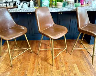 SOLD; Tyler Bicast leather molded counter stool in caramel-colored leather and gold-tone legs; 21x20x39