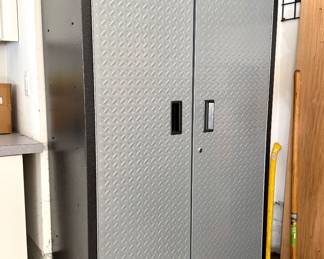 $360; Gladiator brand metal cabinet with locking doors, adjustable shelves, and leveling feet; 36x18x72