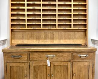 $1500; Universal Furniture brand sideboard with wine holder hutch in light bisque finished veneers; 2-pieces, middle drawer is a felt-lined silver drawer; side doors have platter storage; beautiful piece with 35 horizontal wine shelves; 74x21x92. Top piece is shown not attached for easy move. 