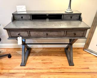 $250; distressed gray desk with 5 drawers and iron bar and black hardware; 48x22x38. Shows normal wear, solid piece. 