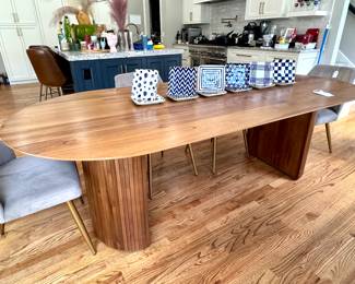 $650; Russo extra-long oval table with slatted wood curved base; 96x42x30