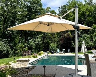 $350; Purple Leaf umbrella with articulating arm and water filled base (as is--one arm is cracked, has been repaired and works great); 10'd