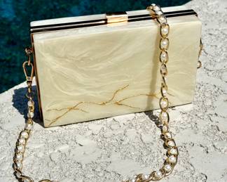 $28; marble-look and gold hard case purse