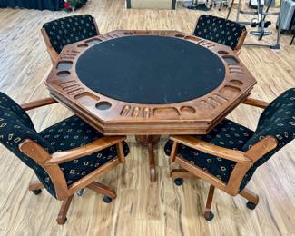 $850; 8-sided wood table with plain top for dining, flip it over for felt poker table with chip slots and drink holders, take it off for dice/game table, including 4 upholstered armchairs on wheels that raise and lower;  table: 59"dx31"h; chairs: 25"x24"x34"