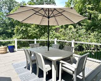 ($600; hand painted Pottery Barn outdoor wood extension table--pops out of the middle--and 2 arm chairs and 4 side chairs with cushions, cover included; table: 74x40x30; arm chairs: 24x26x36; side chairs: 19x26x36) (Sunvilla umbrella with outdoor linen-type fabric and tilt feature, plus floral metal stand; 9'd) ($60; indoor/outdoor rug; 8'x10')