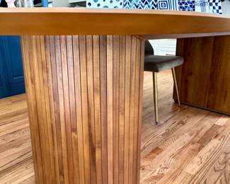 $650; Russo extra-long oval table with slatted wood curved base; 96x42x30; close up of curved base