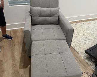 very nice bedroom chair that makes into a very nice bed. The ottoman Folds underneath and pops up, back lays down to make a flatbed.