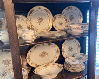 Detail of vintage bow front China cabinet