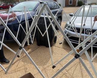 Pop-up canopy, showing the frame, has top