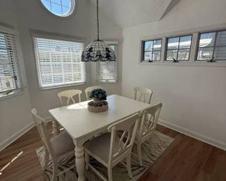 Dining set seats 6; faux Tiffany light fixture; area rug