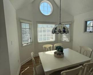 Dining set seats 6; faux Tiffany light fixture; area rug
