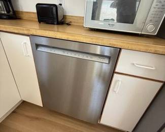 KitchenAid dishwasher with stainless steel interior; microwave oven