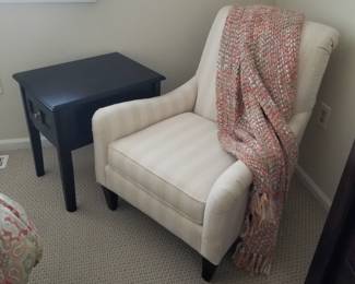 Brown end table; accent chair