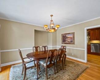 Solid wood, Wide Dining Table and 6 upholstered chairs
78" long x 44" wide
It has 1 extension piece in it, but can be removed to make it 60" long
6 chairs - 2 arm chairs + 4 armless chairs - with gold fabric seating.