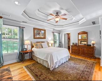 Bedroom furniture (queen bed, dresser with mirror, tall dresser (not shown), nightstands, rug and pictures)