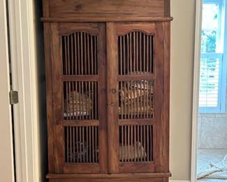 Vintage Birdcage style wooden cabinet / hutch with framed dowel panel doors
1 shelf
39" w x 26" d x 71" h
Gorgeous wood, excellent condition & very sturdy. A true statement piece!
Doors can open to rest flat on side of cabinet if desired. Has a skeleton key lock.