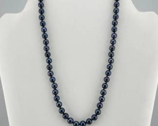 Very beautiful lustrous 14kt navy iridescent pearl necklace; 17.25"L
