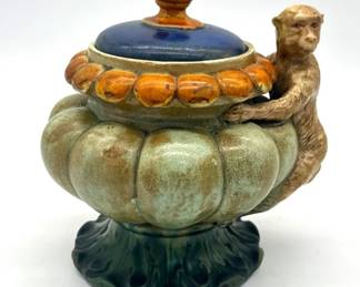 Majolica lidded jar with monkey
