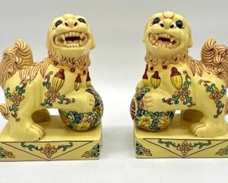 Pair of decorative ceramic yellow foo dogs