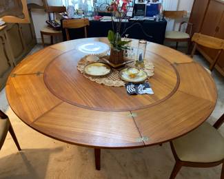 Flip-Flap MCM Dyrlund dining room table (open)… they “leaves” fold and slide under the table…. Stunning craftsmanship!