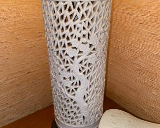 1 of a pair of creamy white lamps with cut out design