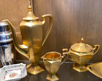 Fancy golden coffee service with cream/sugar and serving pieces