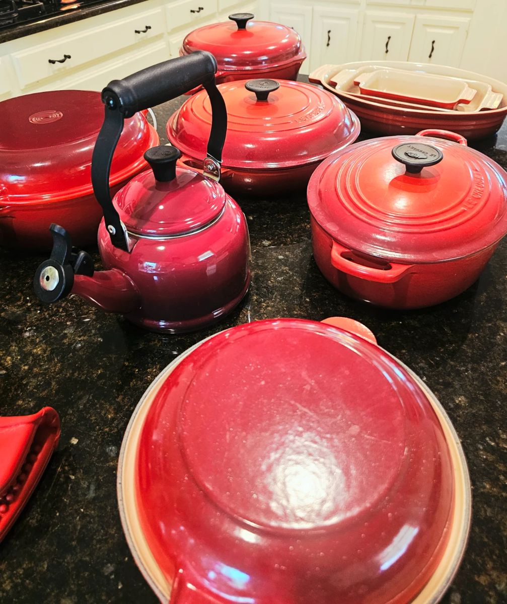 Assorted red Le Creuset . Sold separately