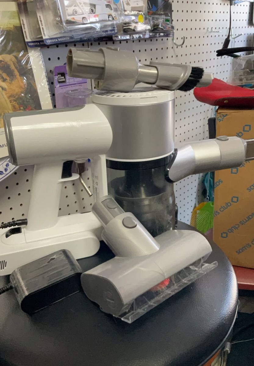 Working, ePro Handheld Vacuum with digital display. Includes original charger and three Vacuum head attachments. $50.00