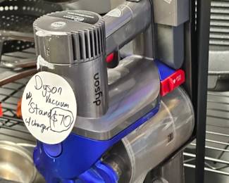 Working, Dyson Stick Vacuum with Brush Head Attachments, Original Charger. Convenient standalone Vacuum stand will be included along with Vacuum Purchase.