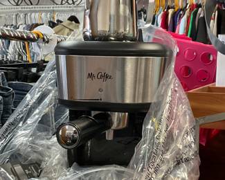 New mr. Coffee manual espresso machine with attached steam wand for frothing milk of choice.