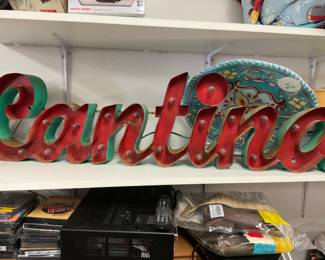 Metal cantina sign wired to be lit up with light bulbs. Working Electronics needs fresh bulbs.