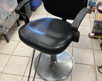 Height adjustable barber chair.