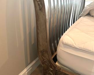 detail of the metal design on  the king size bed