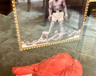 Large shadow of Muhammad Ali memorabilia. 27" wide, 7.5" deep, 32" tall.