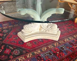 heavy plaster fish base with round glass coffee table