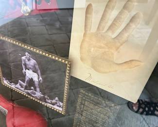Large shadow of Muhammad Ali memorabilia. 27" wide, 7.5" deep, 32" tall.