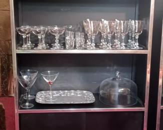 Another vintage black and chrome detailed shelf with a gorgeous set of Chrystal 